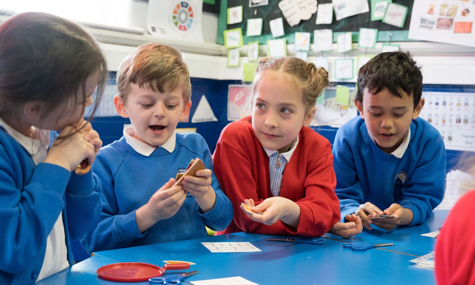 Starbeck Primary Academy - pupils working together in class writing in their notepads